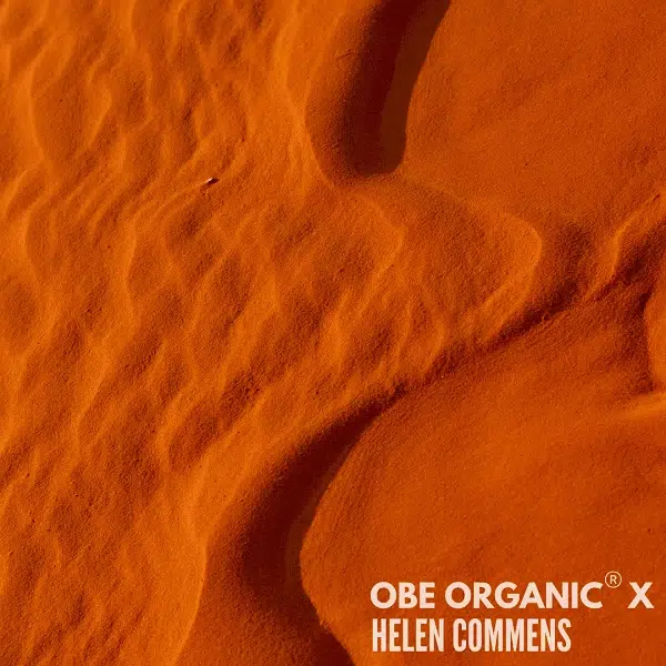 Close-up of smooth, wind-sculpted red sand dunes.