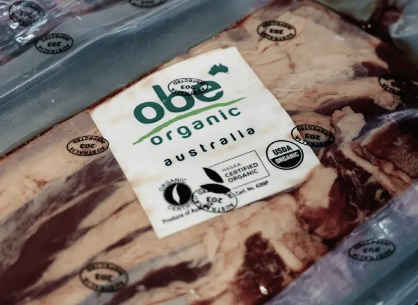 Vacuum-sealed package of OBE Organic beef with product label visible.