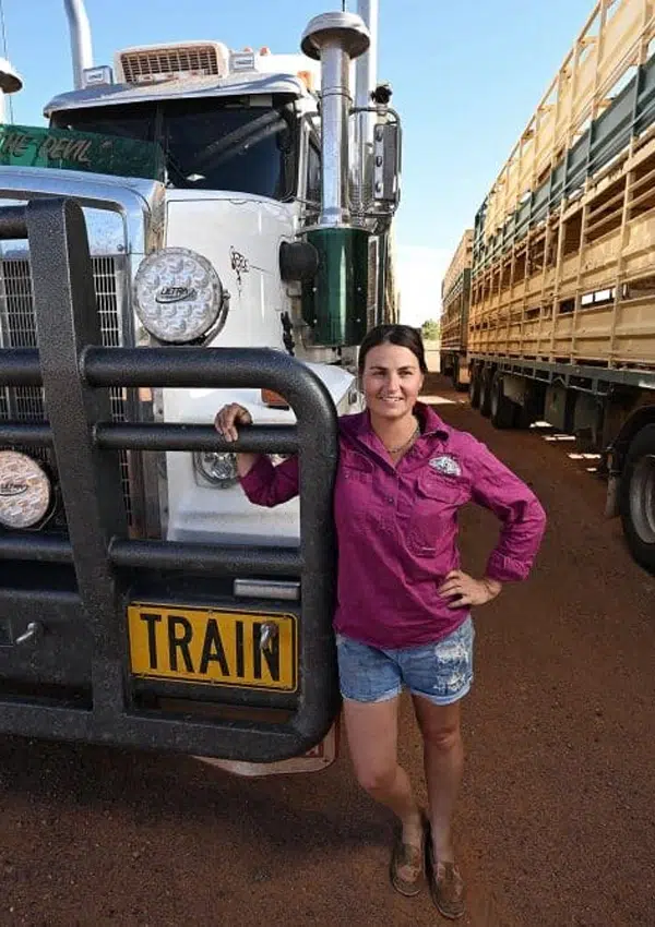 Skye Loveday right beside the bumper of the truck